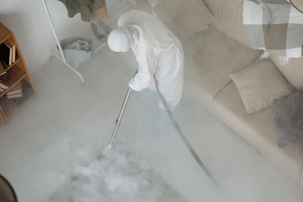Biohazard cleanup technician in protective equipment, Hallandale Beach, FL